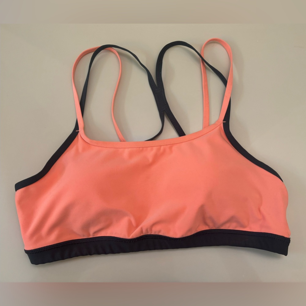 Athletic Works peachy coral and charcoal grey sports bra